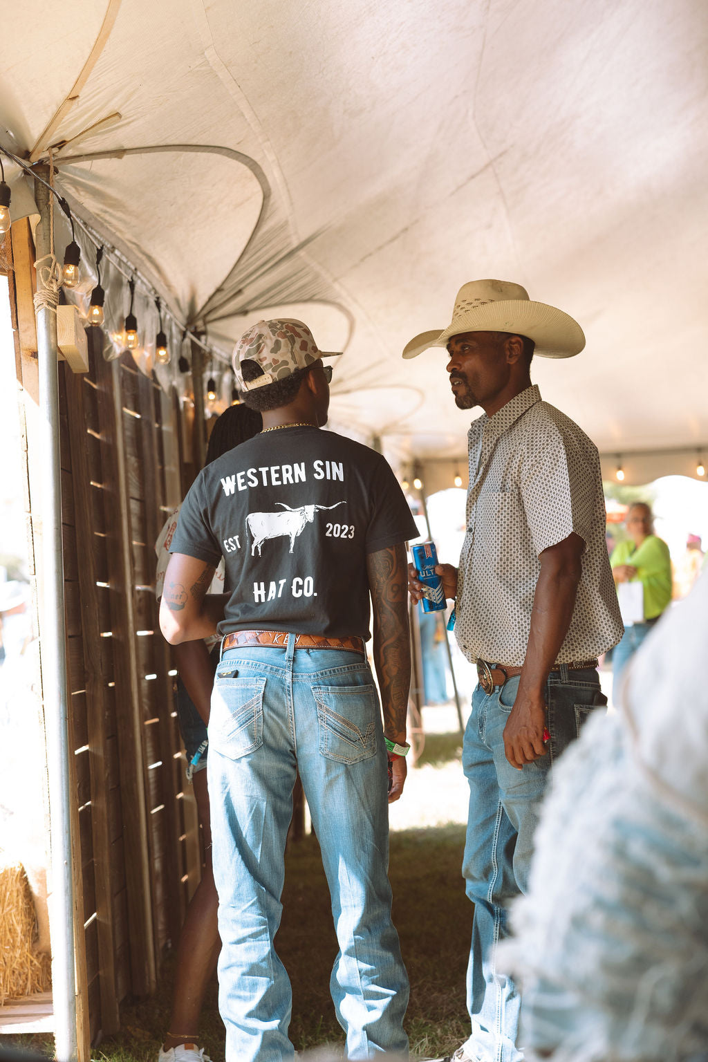 All hat no cattle back of t-shirt wearing it