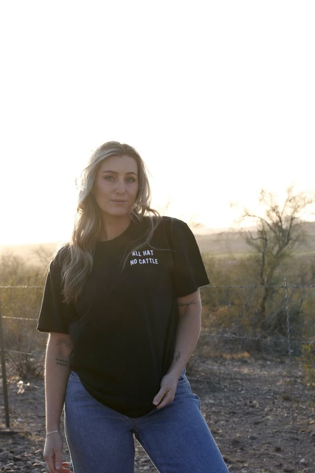Girl wearing all hat no cattle t-shirt